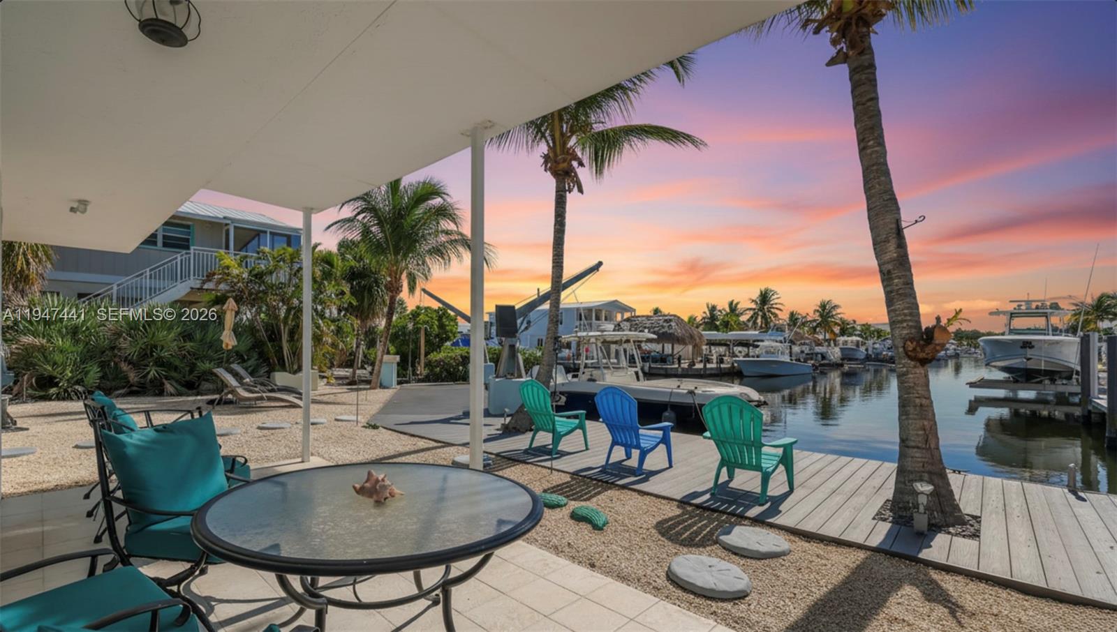 21 Mangrove Lane Key Largo, FL 33037 - Photo 1 of 48 a view of a terrace with furniture and a table