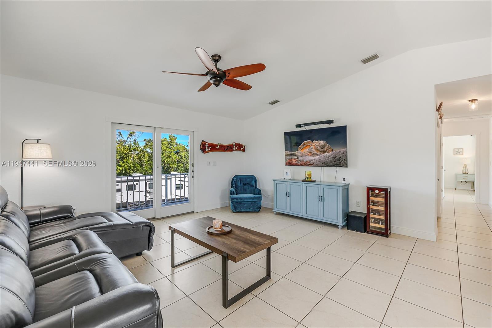 21 Mangrove Lane Key Largo, FL 33037 - Photo 11 of 48 a living room with furniture and a window