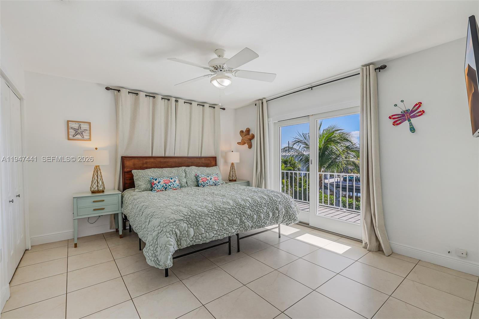 21 Mangrove Lane Key Largo, FL 33037 - Photo 12 of 48 a bedroom with a bed and a window
