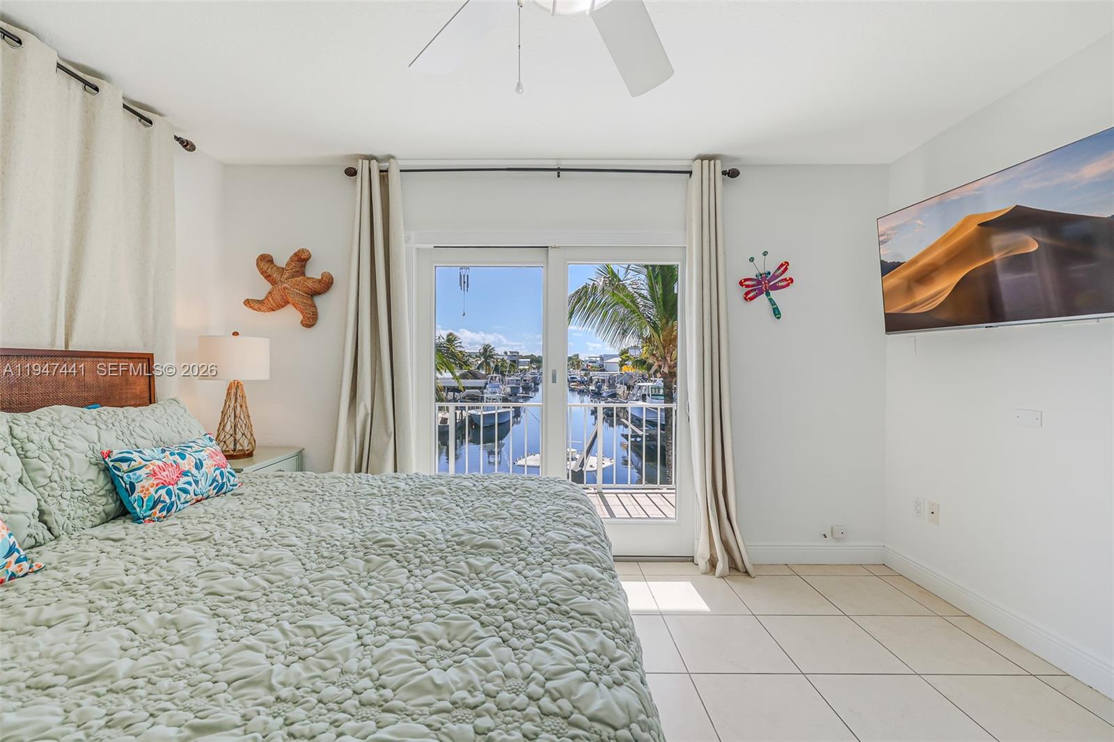 21 Mangrove Lane Key Largo, FL 33037 - Photo 14 of 48 a bedroom with furniture and flowers