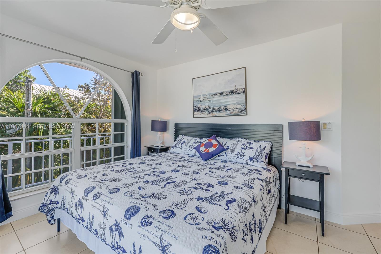 21 Mangrove Lane Key Largo, FL 33037 - Photo 17 of 48 a bedroom with a bed and a large window