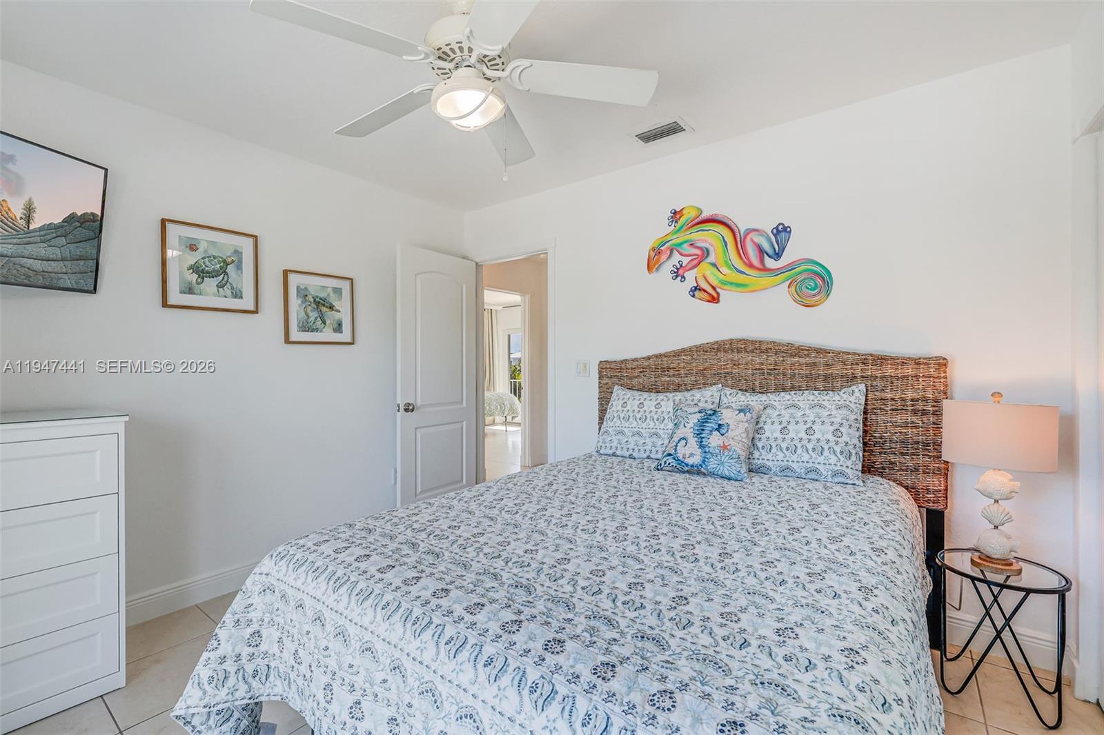 21 Mangrove Lane Key Largo, FL 33037 - Photo 21 of 48 a bedroom with a bed and ceiling fan