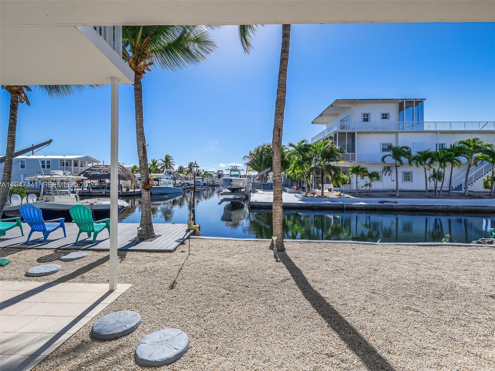 21 Mangrove Lane Key Largo, FL 33037 - Photo 26 of 48 a view of swimming pool with outdoor seating