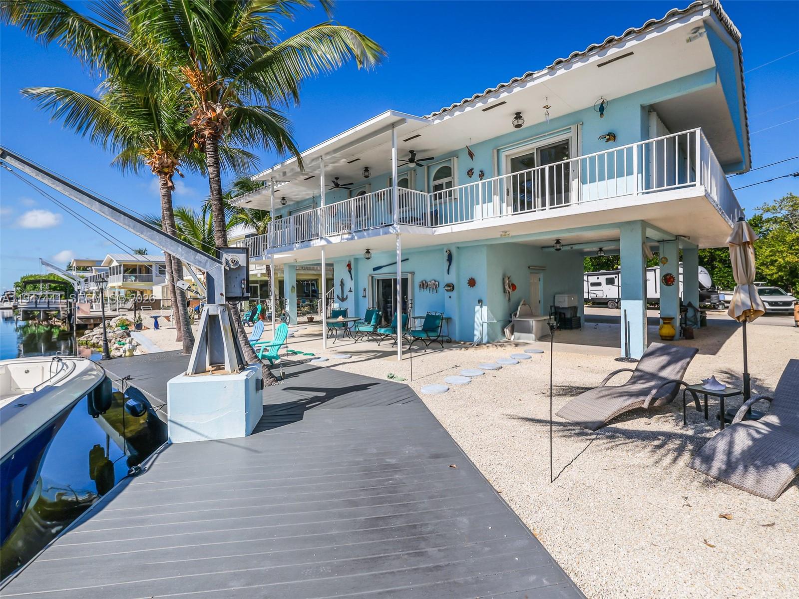 21 Mangrove Lane Key Largo, FL 33037 - Photo 29 of 48 a building exterior with furniture