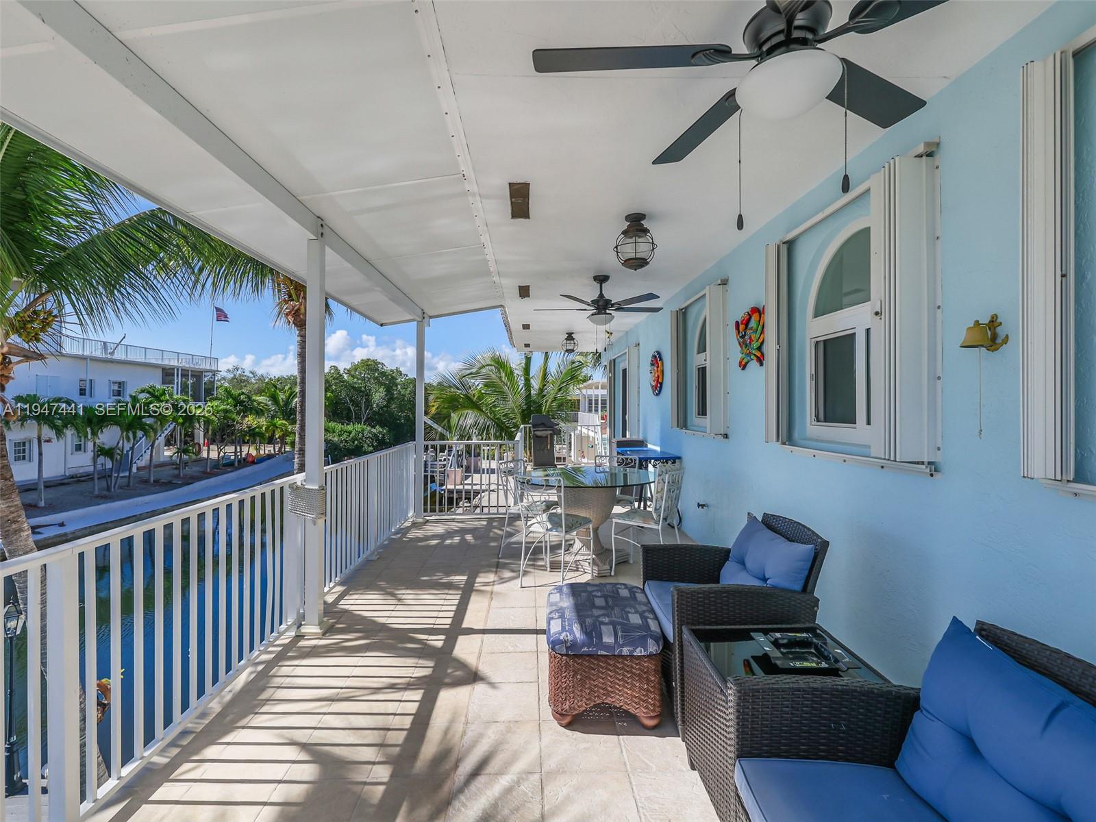 21 Mangrove Lane Key Largo, FL 33037 - Photo 36 of 48 a view of a patio filled with furniture