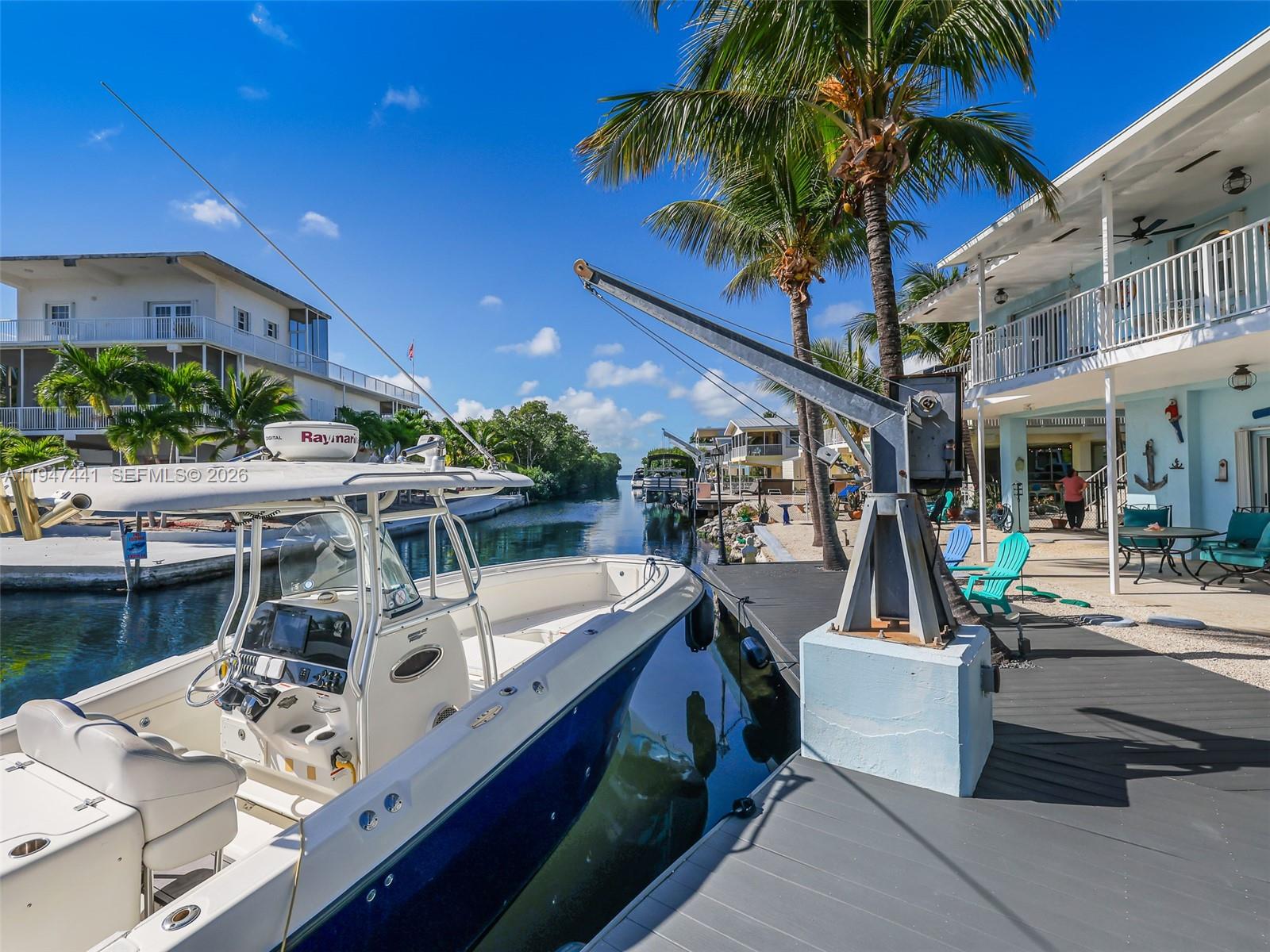 21 Mangrove Lane Key Largo, FL 33037 - Photo 37 of 48 a view of a patio with couches and potted plants