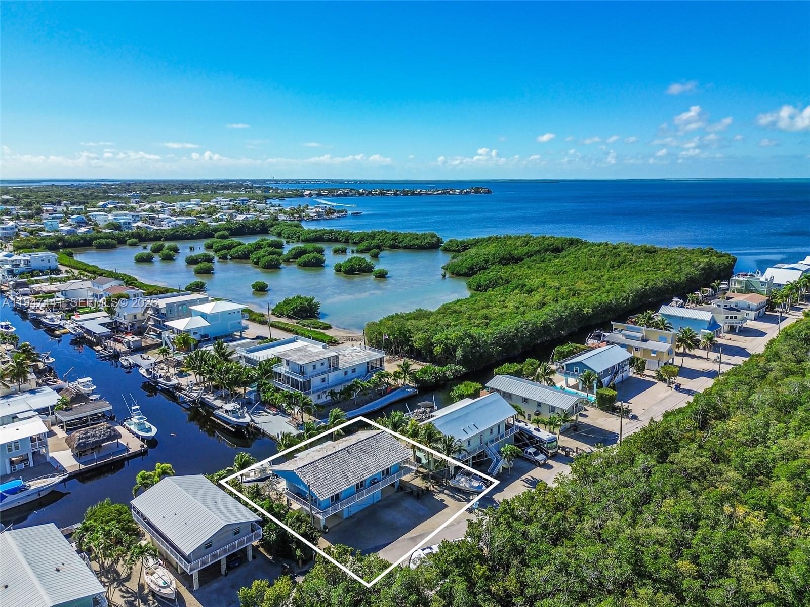 21 Mangrove Lane Key Largo, FL 33037 - Photo 42 of 48 an aerial view of a house with a lake view