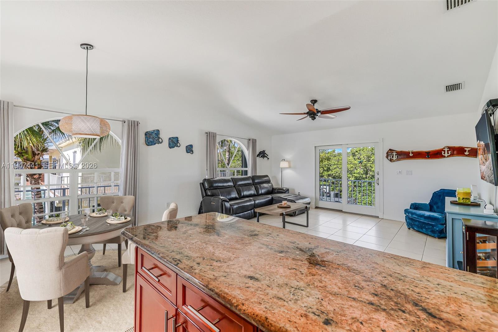 21 Mangrove Lane Key Largo, FL 33037 - Photo 9 of 48 a kitchen with a table and chairs in it