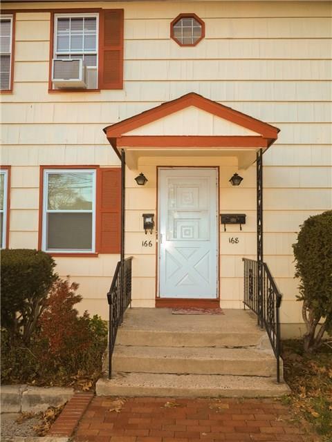 166 Ruth Street Bridgeport, CT 06606 - Photo 1 of 1 a front view of a house with a yard