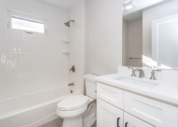 a bathroom with a sink a toilet and a bathtub