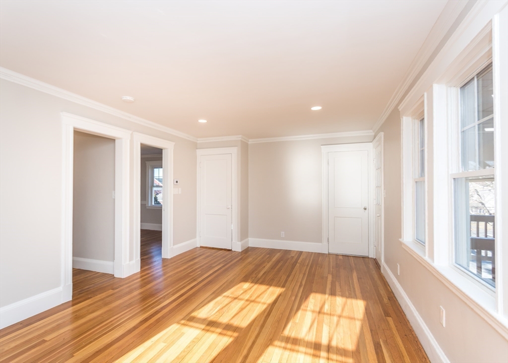 78 Barbara Road, Unit 1 Waltham, MA 02453 - Photo 8 of 15 a view of a room with wooden floor and natural light