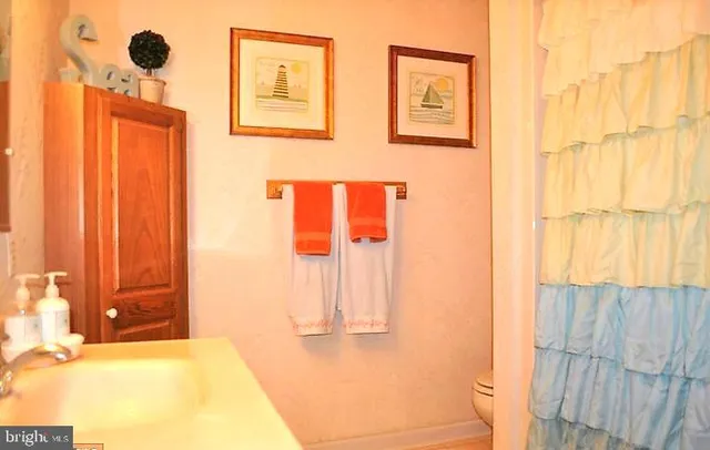 a bathroom with a tub and shower