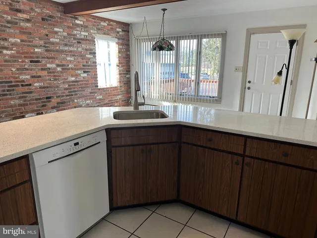a kitchen with a sink and a window