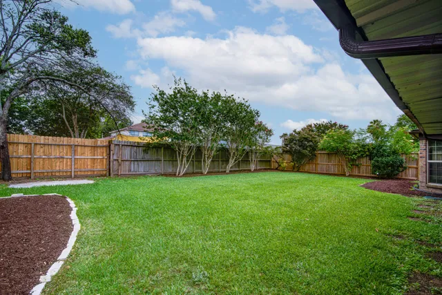 a view of a backyard with a garden