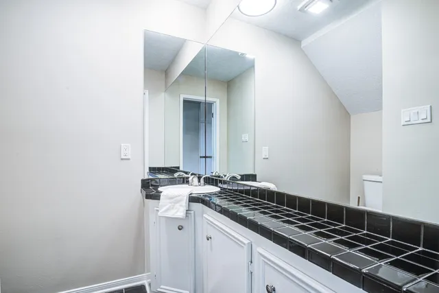 a stove top oven sitting inside of a kitchen