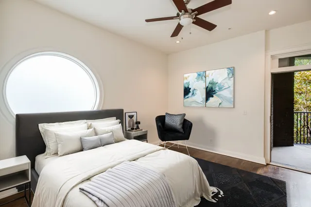 a bedroom with bed and window