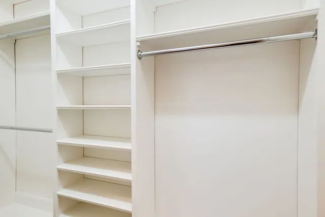 a view of an empty walk in closet