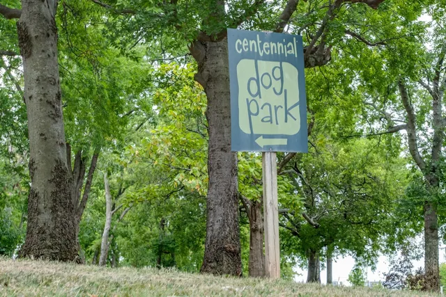 a sign broad on wooden fence