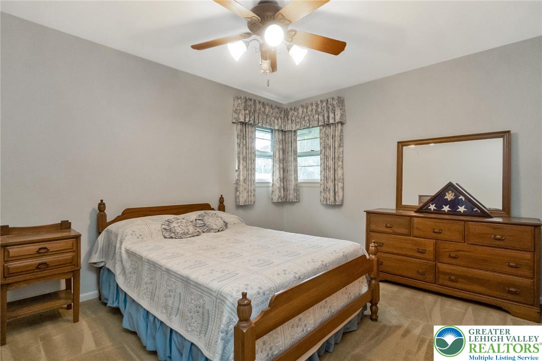 1328 Russett Road Allentown, PA 18104 - Photo 25 of 46 A comforting bedroom space features carpeted flooring and ample natural light through multiple windows.