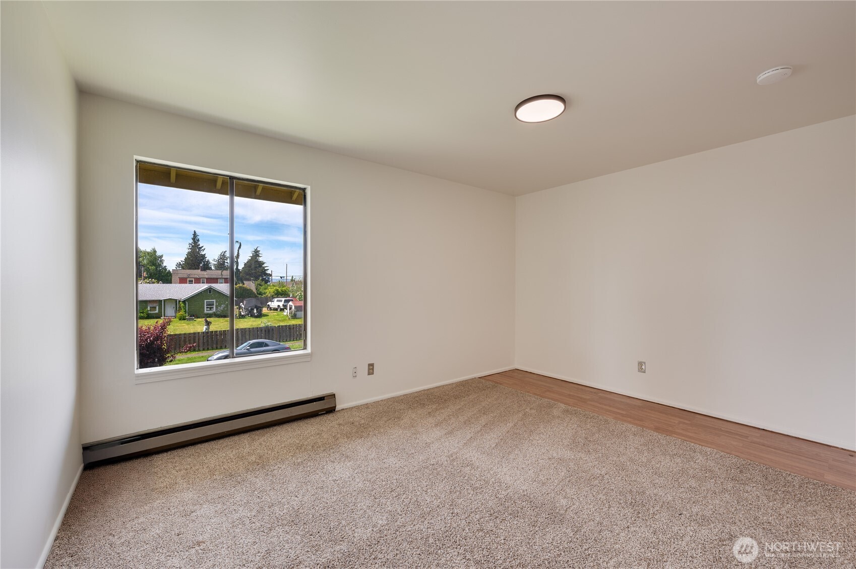 310 South 11th Street, Unit 212 Mount Vernon, WA 98274 - Photo 14 of 18 an empty room with windows and view