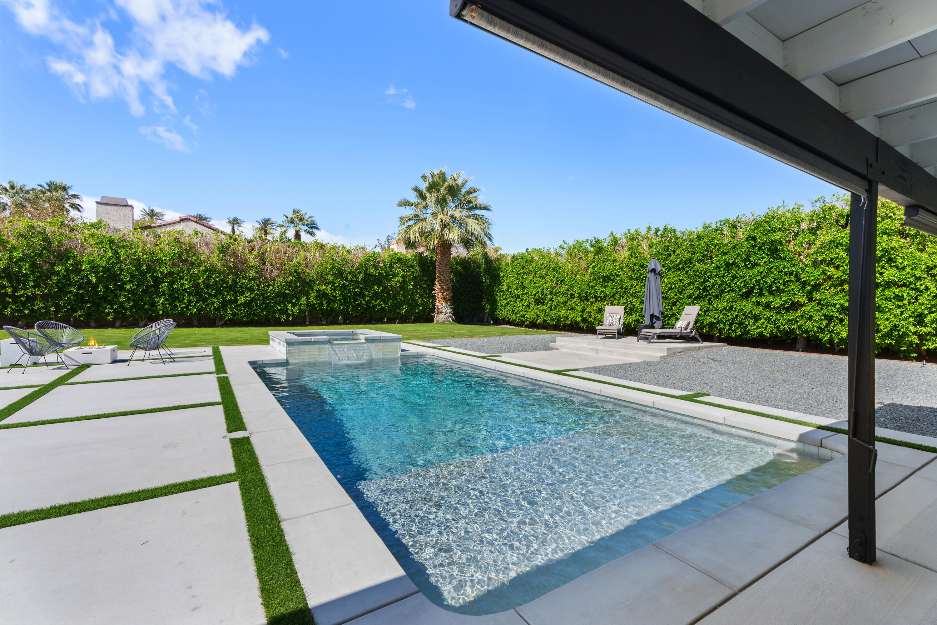 37081 Palmdale Road Rancho Mirage, CA 92270 - Photo 5 of 46 a view of a swimming pool with a patio