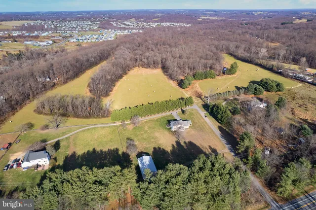 an aerial view of a house with a lake view