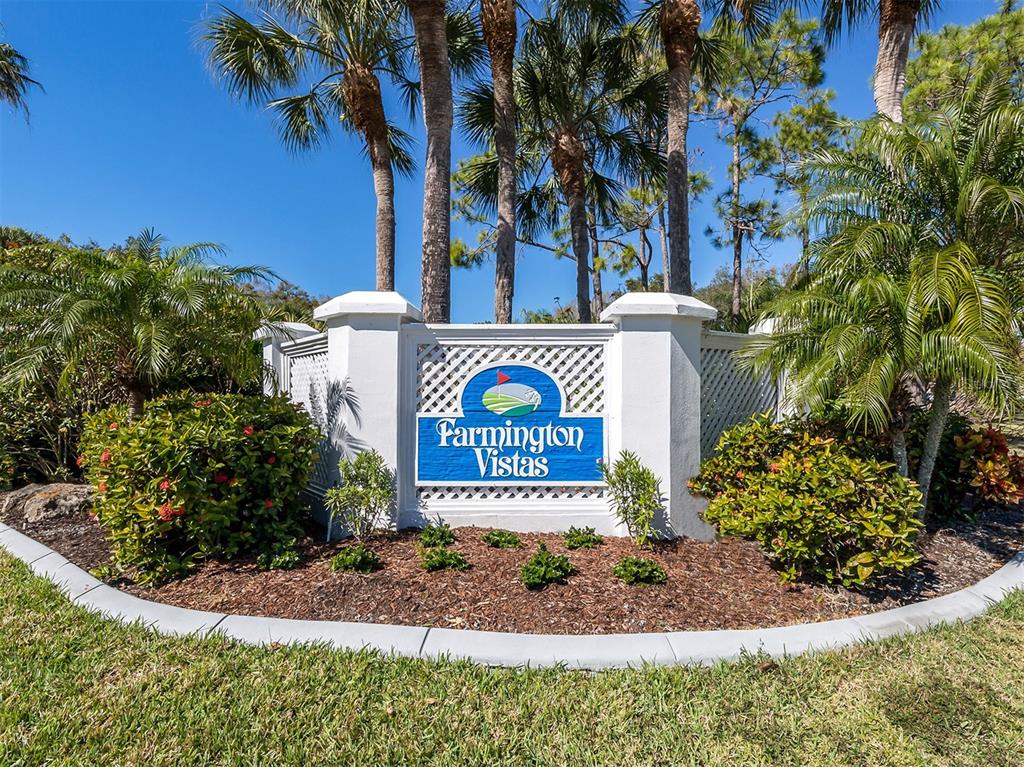 437 Cerromar Lane, Unit 312 Venice, FL 34293 - Photo 35 of 68 a view of sign board with flower plants