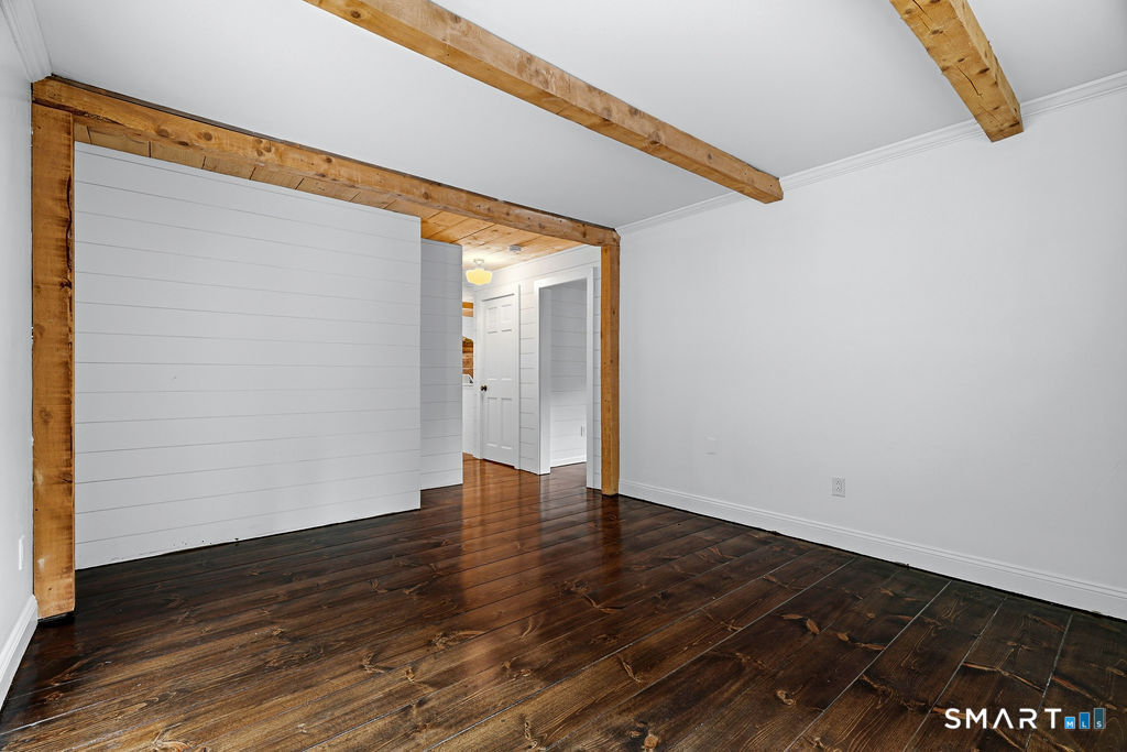 17 Florida Road East Haddam, CT 06423 - Photo 14 of 40 Featuring beams creating architectural interest with easy access to the main level bathroom, kitchen & adjacent room off the front of the house.