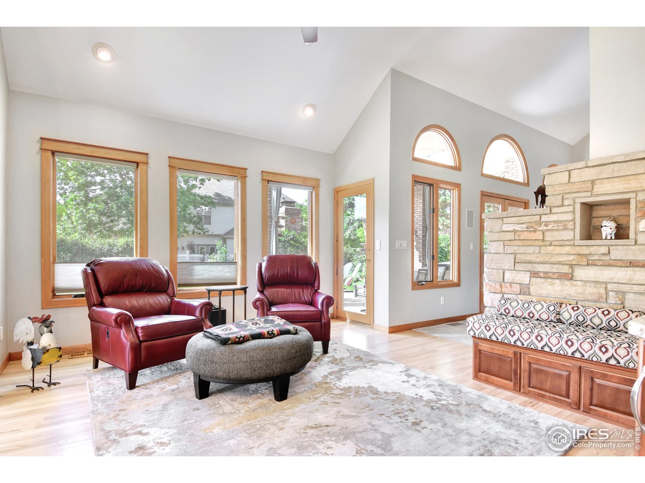 1301 Ruby Way Longmont, CO 80504 - Photo 13 of 37 Sitting Room Exits to Backyard Covered Porch