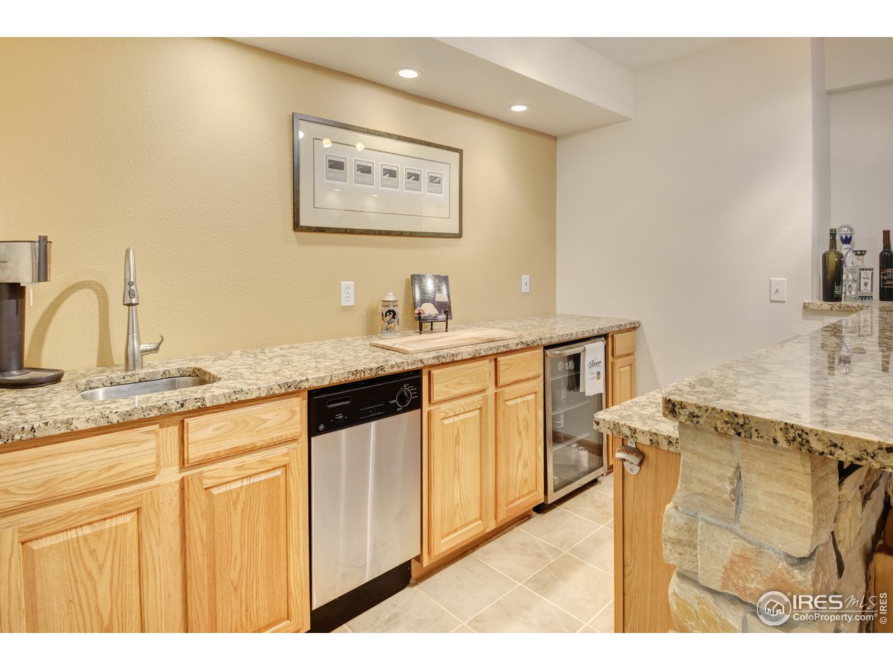 1301 Ruby Way Longmont, CO 80504 - Photo 32 of 37 Basement Wet Bar with Dishwasher and Wine Refrigerator