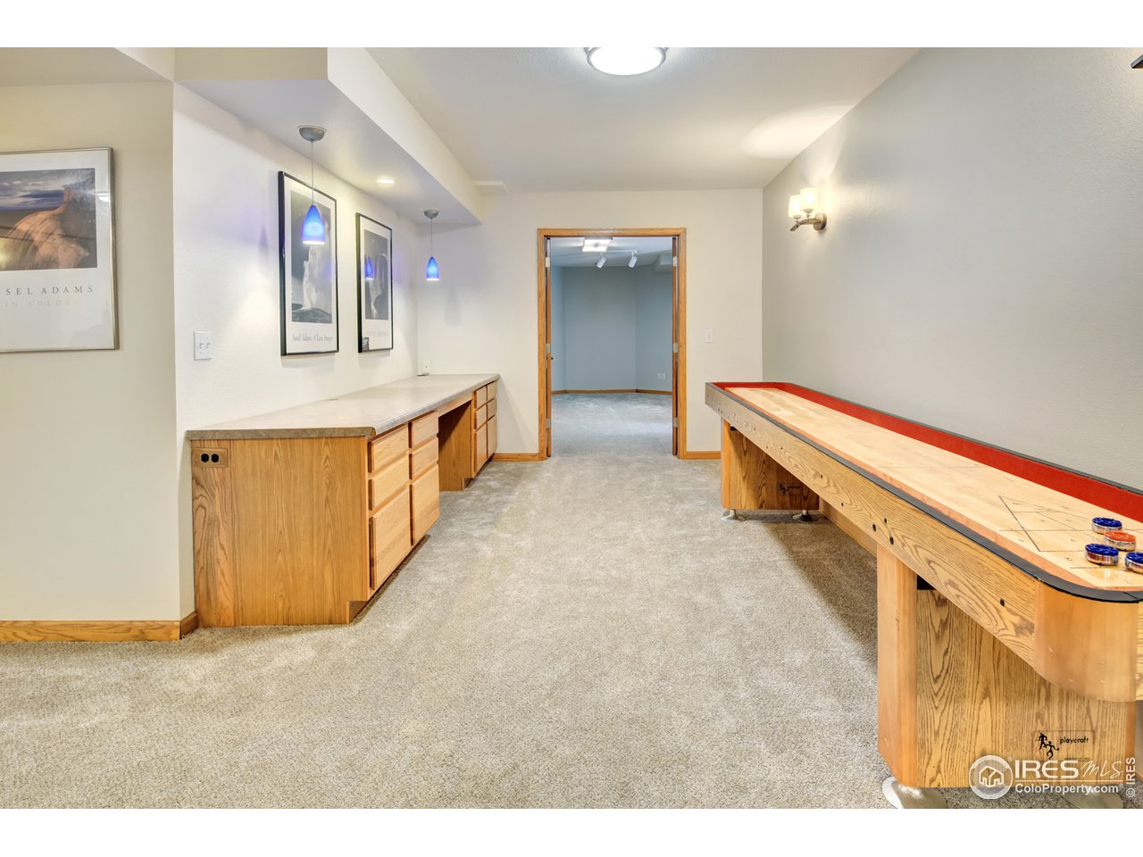 1301 Ruby Way Longmont, CO 80504 - Photo 35 of 37 Basement Sewing Table and Shuffleboard