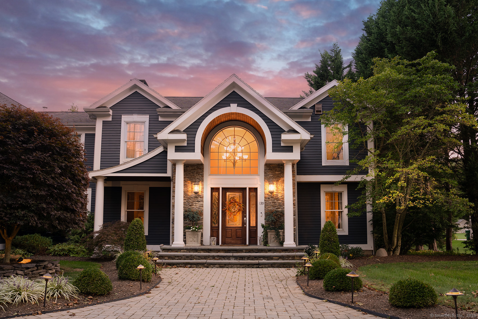 a front view of a house with a yard