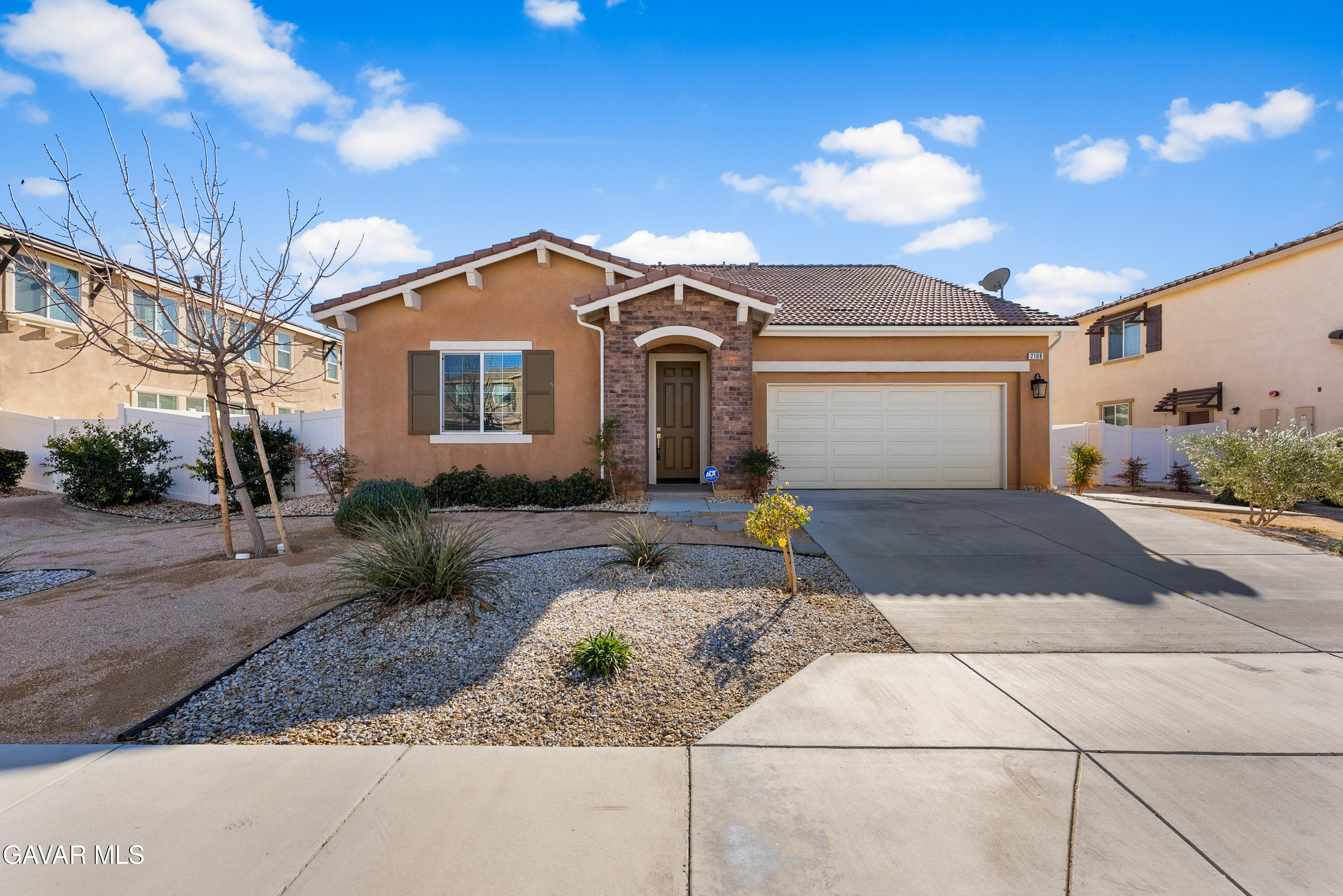 2108 Cork Oak Street Palmdale, CA 93551 - Photo 17 of 55 a front view of a house with a yard