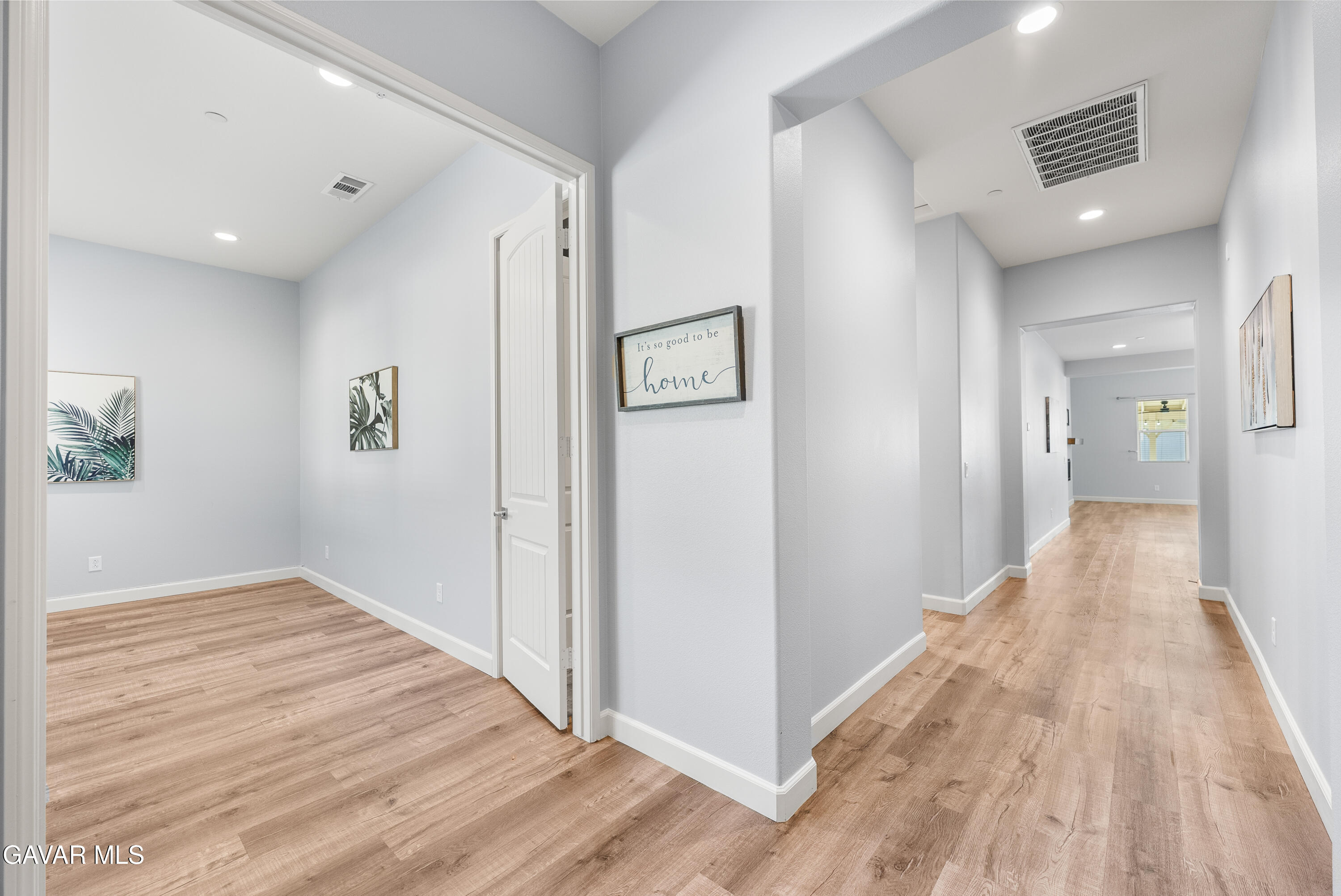 2108 Cork Oak Street Palmdale, CA 93551 - Photo 19 of 55 a view of a hallway with wooden floor and closet