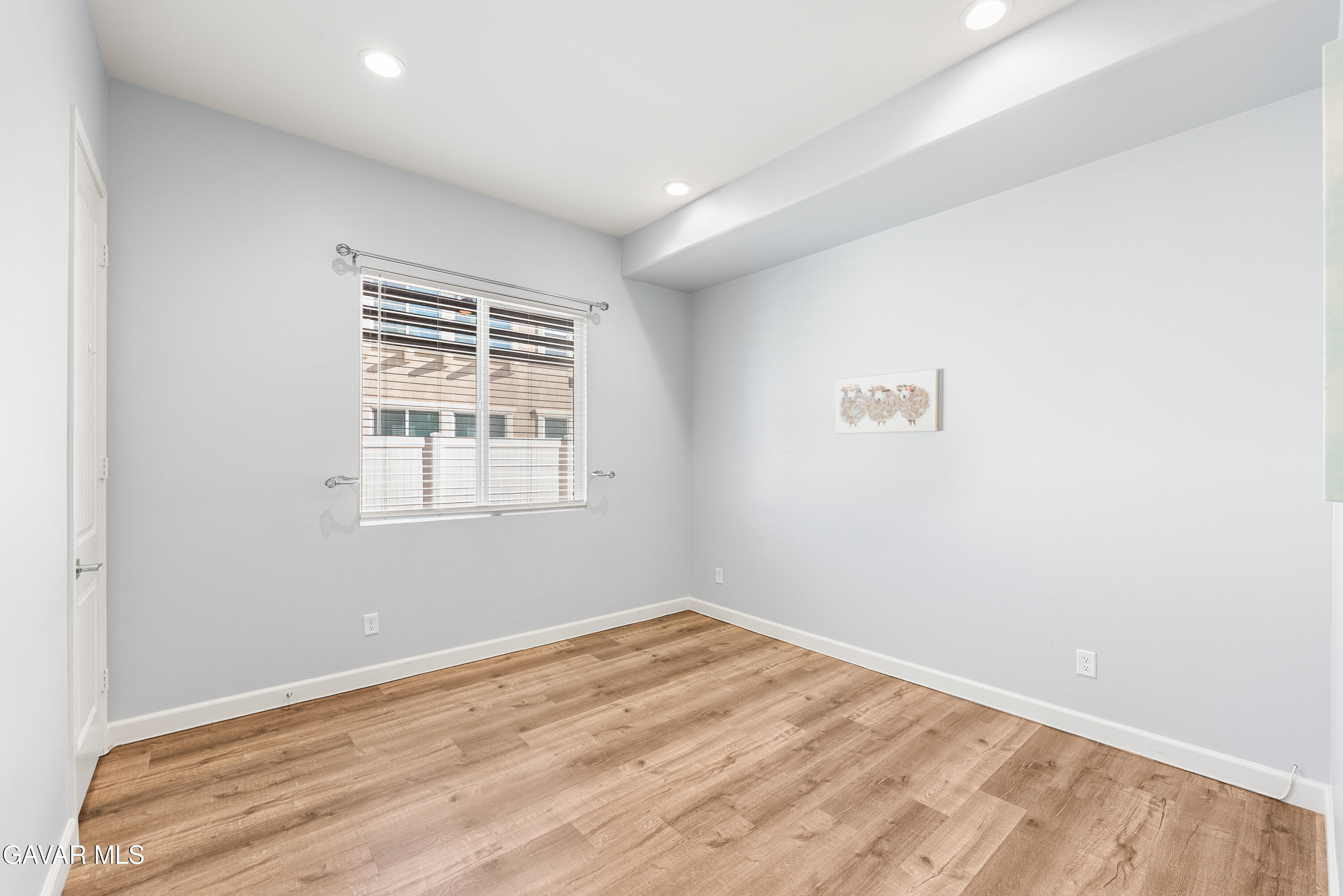2108 Cork Oak Street Palmdale, CA 93551 - Photo 25 of 55 a view of empty room with wooden floor and fan