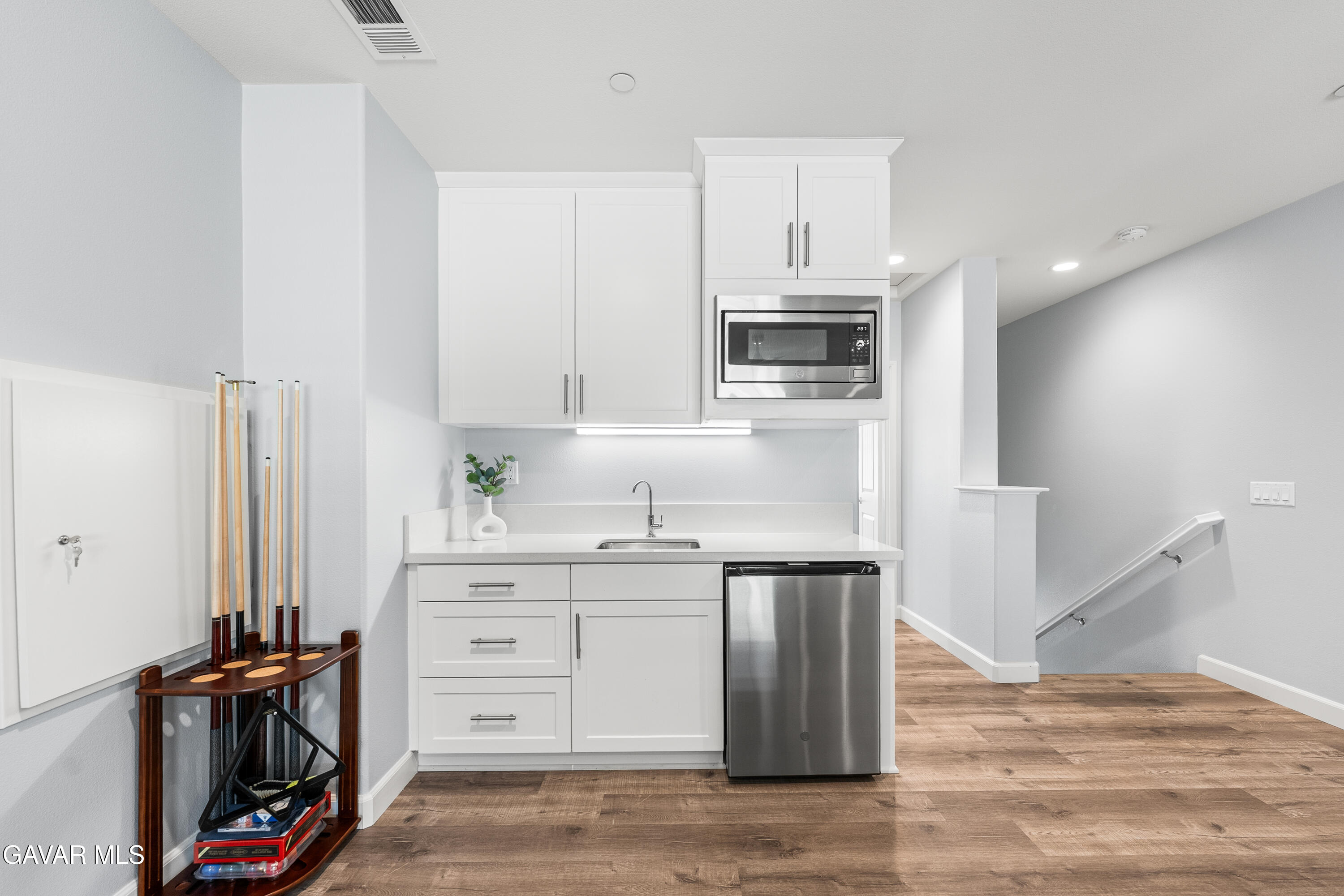 2108 Cork Oak Street Palmdale, CA 93551 - Photo 9 of 55 a kitchen with stainless steel appliances a stove refrigerator and cabinets
