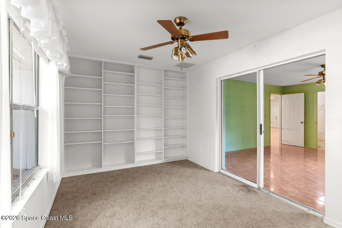 2493 Adamson Road Cocoa, FL 32926 - Photo 36 of 46 an empty room with a empty space and windows