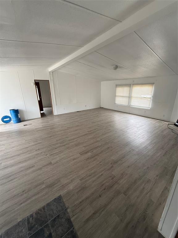 118 Happy Trl Court Rhome, TX 76078 - Photo 3 of 9 a view of a room with wooden floor