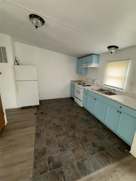 118 Happy Trl Court Rhome, TX 76078 - Photo 4 of 9 a kitchen with granite countertop a stove and a sink