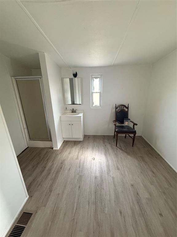 118 Happy Trl Court Rhome, TX 76078 - Photo 6 of 9 a living room with furniture and a wooden floor