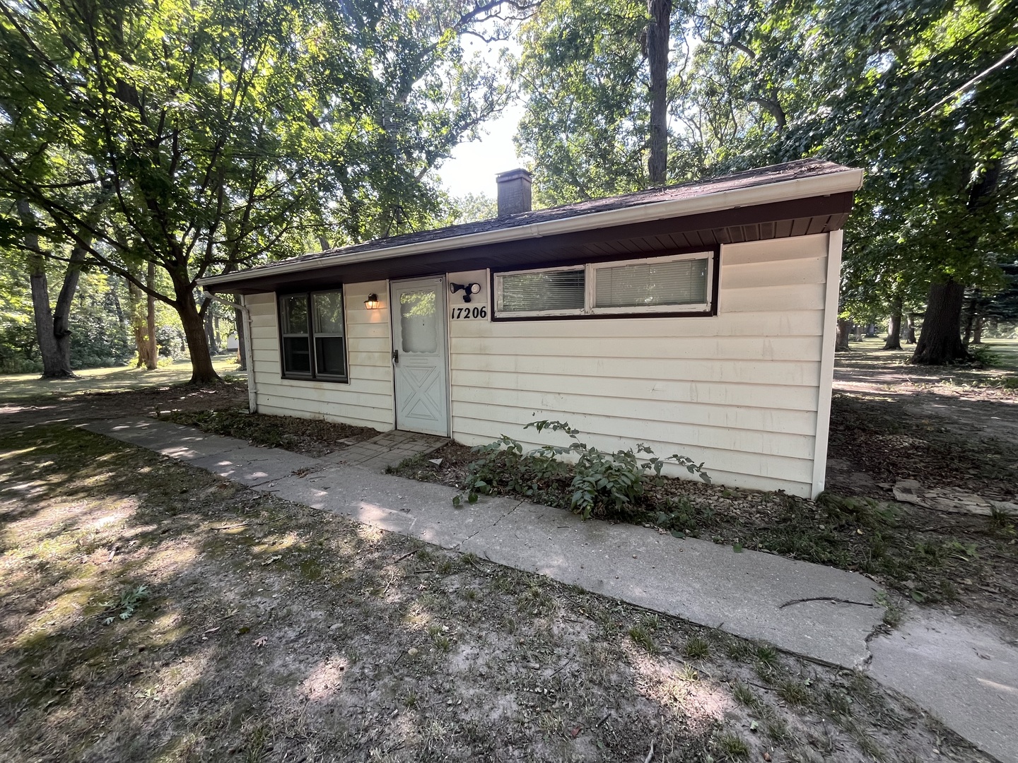 17206 South Lily Cache Road Plainfield, IL 60586 - Photo 1 of 7 a front view of a house with garden
