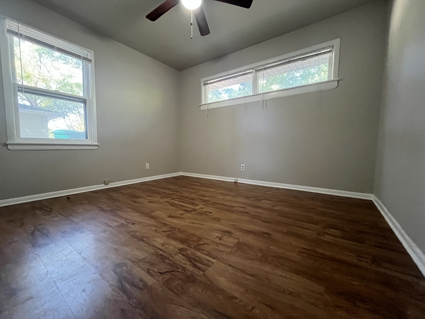 17206 South Lily Cache Road Plainfield, IL 60586 - Photo 4 of 7 a view of empty room with wooden floor and fan
