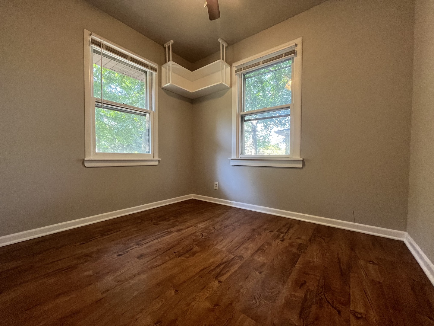 17206 South Lily Cache Road Plainfield, IL 60586 - Photo 6 of 7 a view of an empty room with wooden floor and a window
