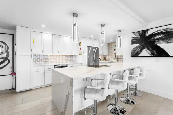 a kitchen with a sink cabinets and window
