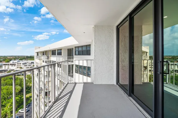 a view of balcony with furniture