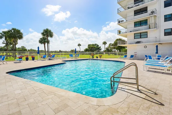 a view of a swimming pool with a lounge chairs