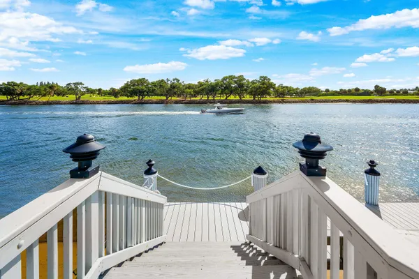 a view of a lake and houses in the back