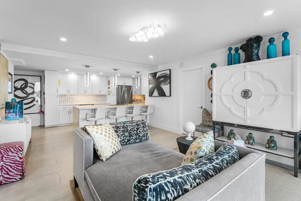 a kitchen with stainless steel appliances granite countertop a sink refrigerator and cabinets