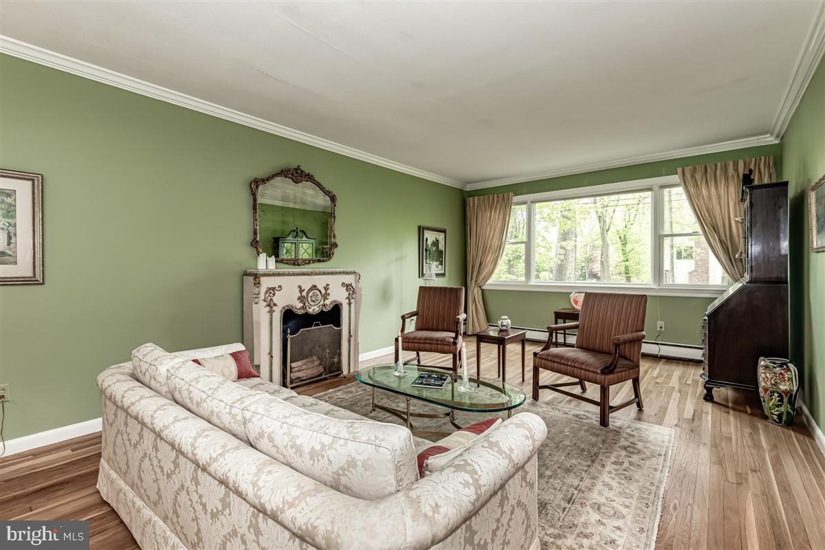 396 Riverside Drive Princeton, NJ 08540 - Photo 3 of 39 a living room with furniture and a fireplace