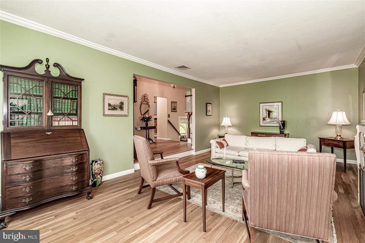396 Riverside Drive Princeton, NJ 08540 - Photo 4 of 39 a living room with furniture a lamp and a table